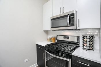Energy efficient stainless steel appliances with gas range and built in microwave